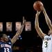 Michigan sophomore Trey Burke shoots a three-point-shot over Illinois Tracy Abrams on Sunday, Feb. 24. Daniel Brenner I AnnArbor.com